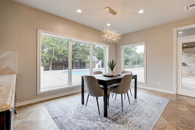 10401 Fawn Trace Rd, Mustang, OK 73064 - dining room with baseboards, visible vents, recessed lighting, a chandelier, and stone finish flooring