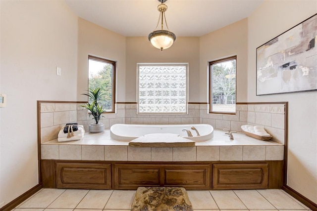 10401 Fawn Trace Rd, Mustang, OK 73064 - full bathroom with plenty of natural light, a garden tub, and tile patterned floors