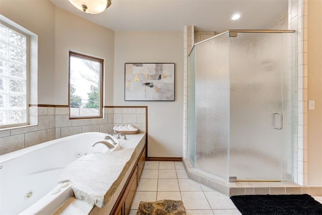 10401 Fawn Trace Rd, Mustang, OK 73064 - bathroom featuring a tub with jets, tile patterned flooring, and a stall shower