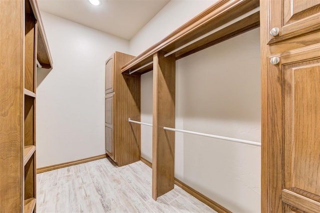 10401 Fawn Trace Rd, Mustang, OK 73064 - spacious closet featuring light wood-style floors