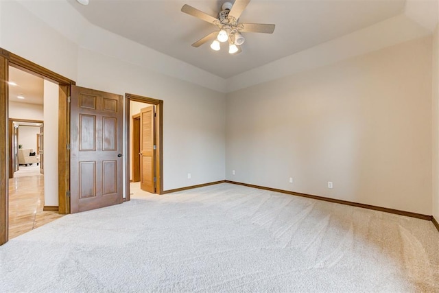 10401 Fawn Trace Rd, Mustang, OK 73064 - unfurnished bedroom featuring light carpet, baseboards, and ceiling fan