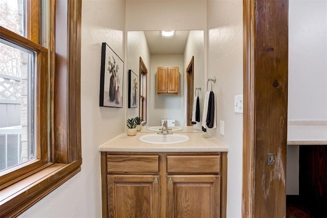 10401 Fawn Trace Rd, Mustang, OK 73064 - bathroom featuring vanity and a wealth of natural light