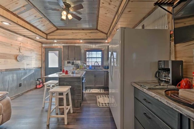 1985 Belpine Loop, Broken Bow, OK 74728 - kitchen with lofted ceiling, a kitchen breakfast bar, sink, and wooden ceiling