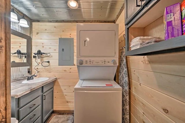 1985 Belpine Loop, Broken Bow, OK 74728 - bathroom with vanity, stacked washer / drying machine, electric panel, and wooden walls
