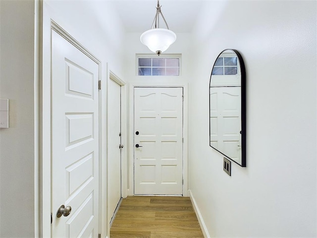 doorway with light hardwood / wood-style floors