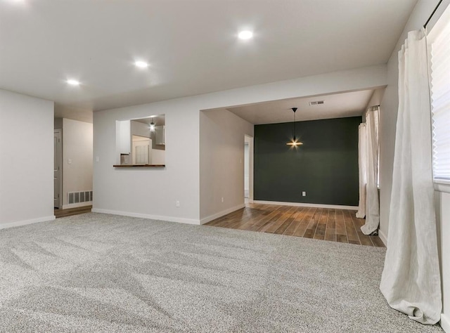 unfurnished room featuring carpet flooring