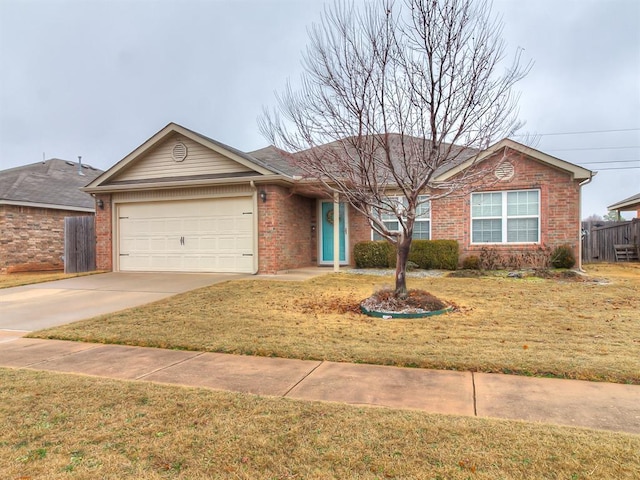 ranch-style house featuring a garage and a front lawn