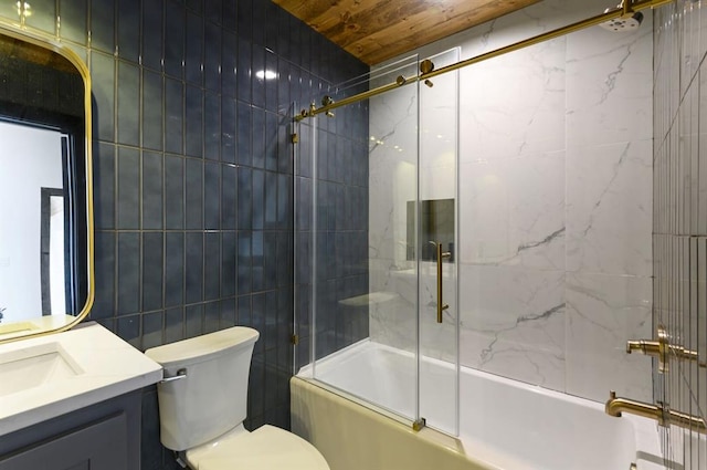 full bathroom featuring vanity, combined bath / shower with glass door, tile walls, and toilet