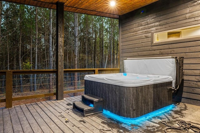 deck featuring a hot tub