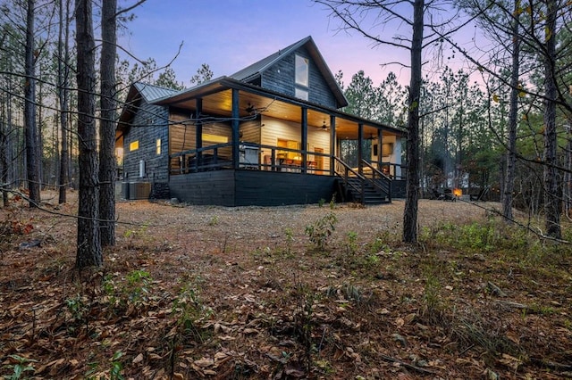 exterior space featuring a porch and central air condition unit