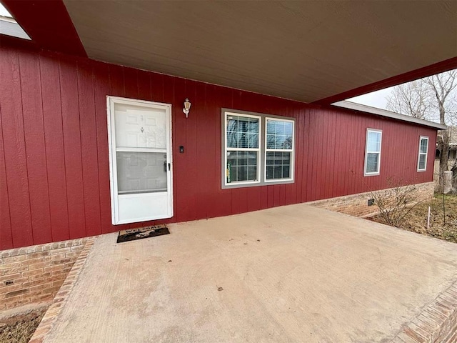 doorway to property with crawl space and a patio