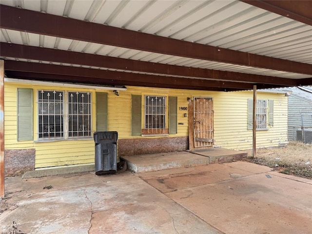 entrance to property featuring a patio