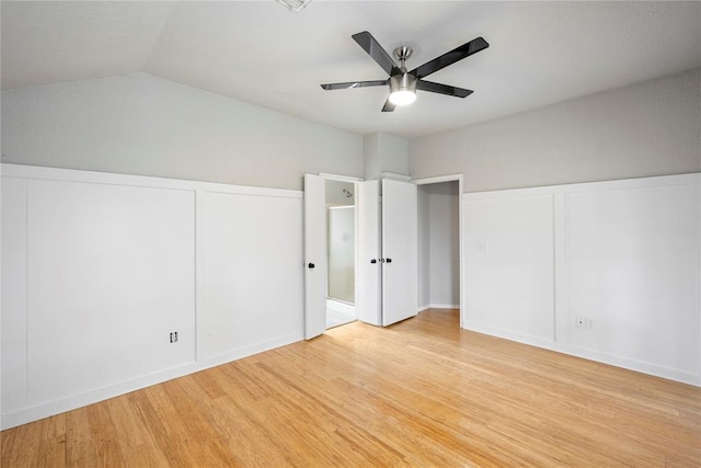 unfurnished bedroom with lofted ceiling, light hardwood / wood-style floors, and ceiling fan