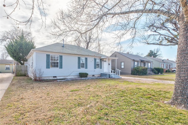 ranch-style house featuring a front lawn