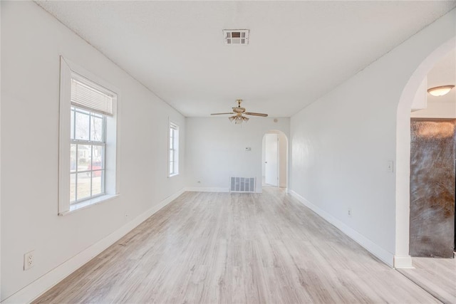 spare room featuring ceiling fan and light hardwood / wood-style floors