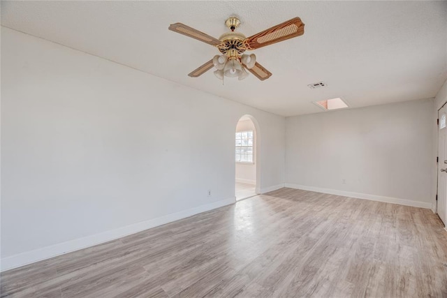 unfurnished room with ceiling fan and light hardwood / wood-style floors