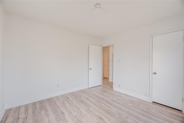 unfurnished room featuring light hardwood / wood-style floors