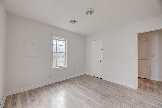 empty room featuring light hardwood / wood-style floors