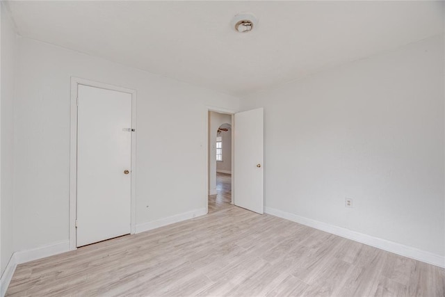 unfurnished room with light hardwood / wood-style floors