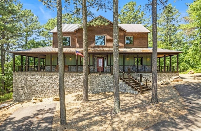 back of house featuring covered porch