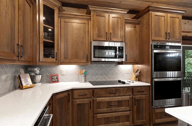 kitchen featuring appliances with stainless steel finishes and backsplash