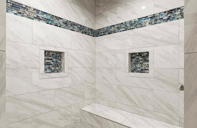 bathroom featuring tiled shower