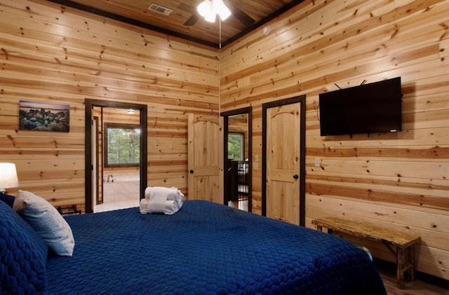 bedroom featuring multiple windows, access to outside, wooden ceiling, and wood walls