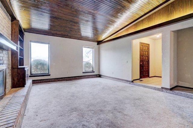 unfurnished living room with a brick fireplace, wood ceiling, vaulted ceiling, and light colored carpet