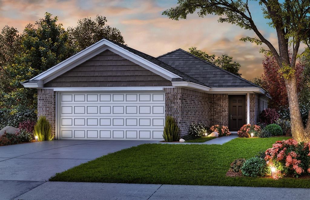 view of front of property with a garage, concrete driveway, a yard, and brick siding