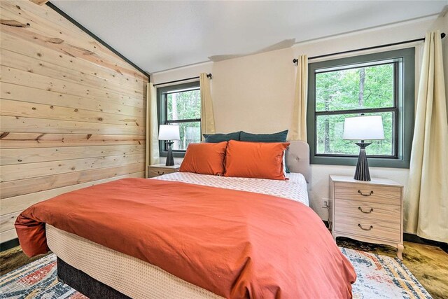 670 Pine Meadow Ln, Broken Bow, OK 74728 - bedroom with vaulted ceiling and wooden walls