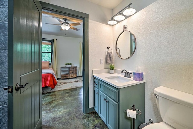 670 Pine Meadow Ln, Broken Bow, OK 74728 - bathroom featuring vanity, concrete floors, ceiling fan, and toilet