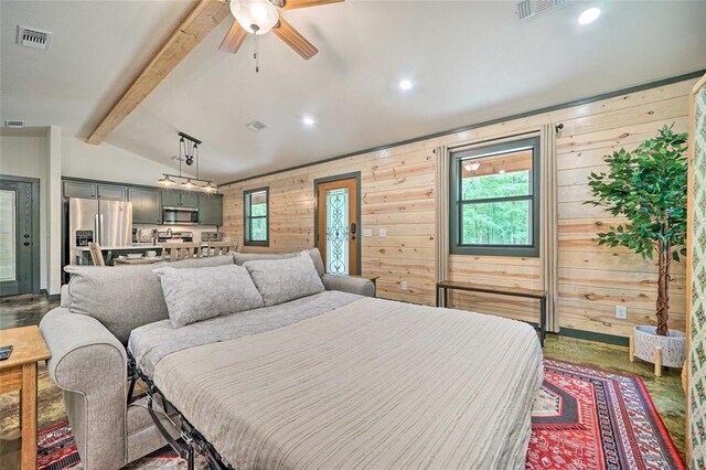 670 Pine Meadow Ln, Broken Bow, OK 74728 - bedroom featuring stainless steel refrigerator with ice dispenser, wooden walls, and lofted ceiling with beams