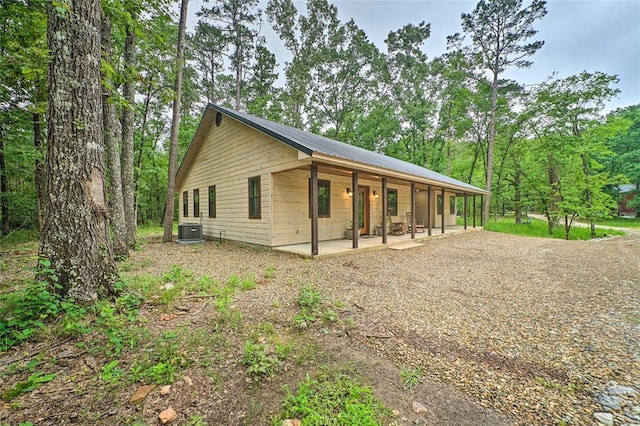 670 Pine Meadow Ln, Broken Bow, OK 74728 - exterior space featuring central AC unit and a patio