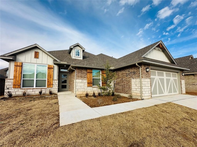 view of front of property featuring a garage and a front lawn