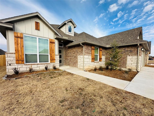 view of front of home featuring a garage and a front lawn