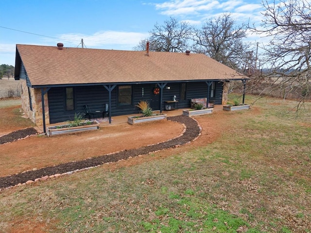 rear view of property with a lawn and a patio area