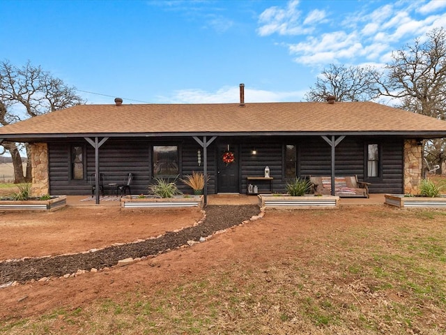 view of log cabin