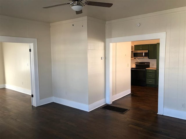 unfurnished room featuring dark hardwood / wood-style floors and ceiling fan