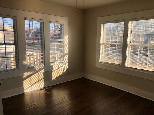 unfurnished room featuring dark hardwood / wood-style floors