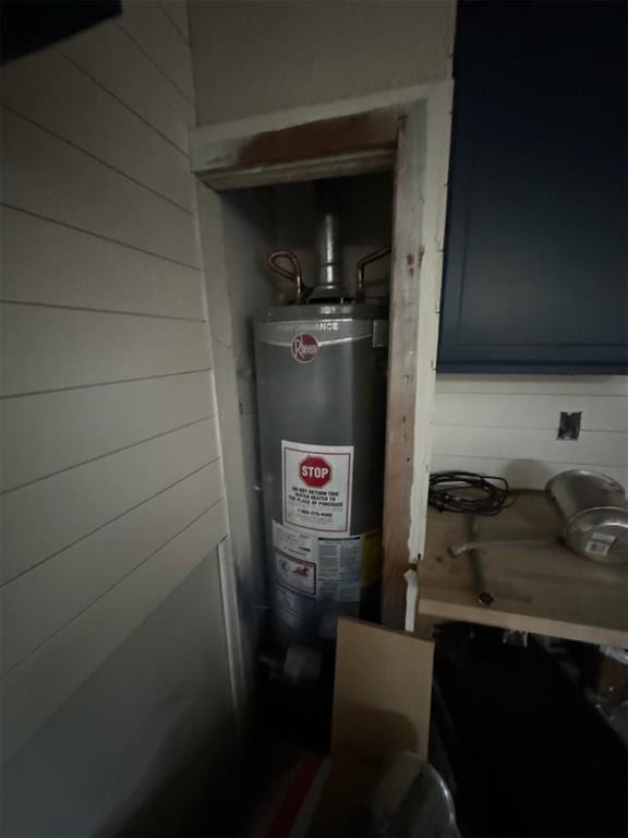 utility room with water heater