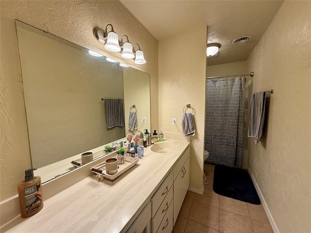 full bathroom featuring tile patterned flooring, vanity, shower / bath combo, and toilet