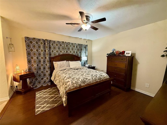 bedroom featuring dark hardwood / wood-style floors and ceiling fan