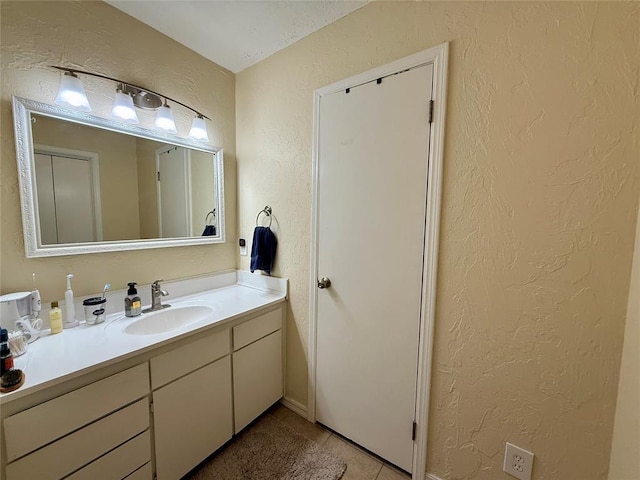 bathroom with vanity and tile patterned floors