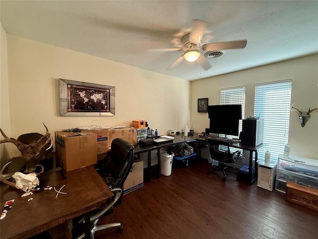 home office with dark wood-type flooring, a textured ceiling, and ceiling fan