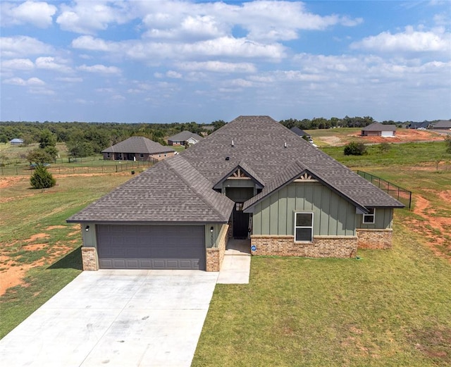 view of front facade with a garage and a front lawn