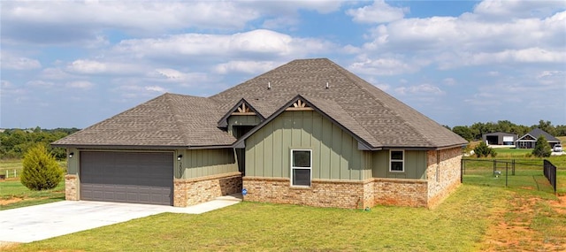 view of front facade featuring a garage and a front lawn