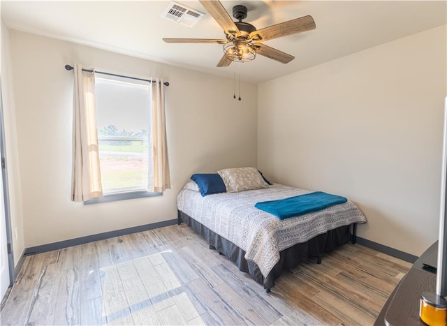 bedroom featuring light hardwood / wood-style flooring and ceiling fan