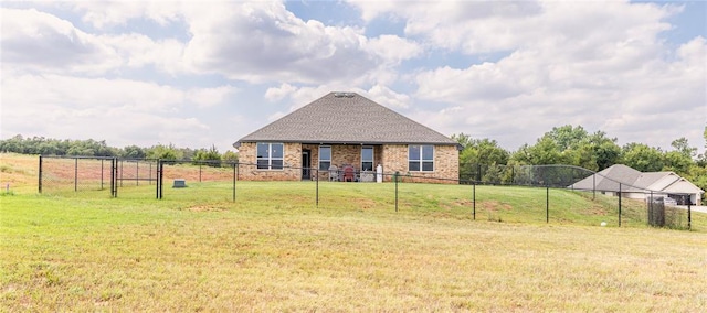 view of front of home featuring a rural view and a front lawn