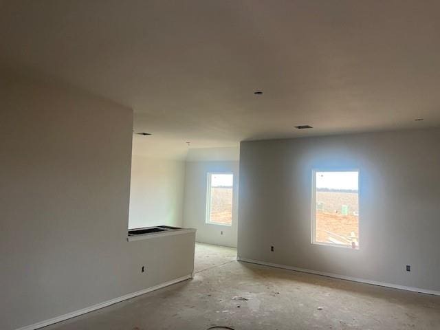 unfurnished room featuring visible vents