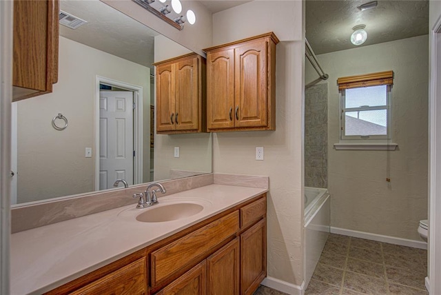 full bathroom with vanity, shower / bathtub combination, and toilet